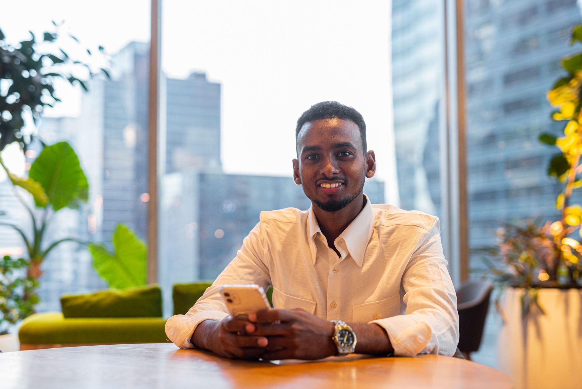 Portrait of young handsome stylish black man in city