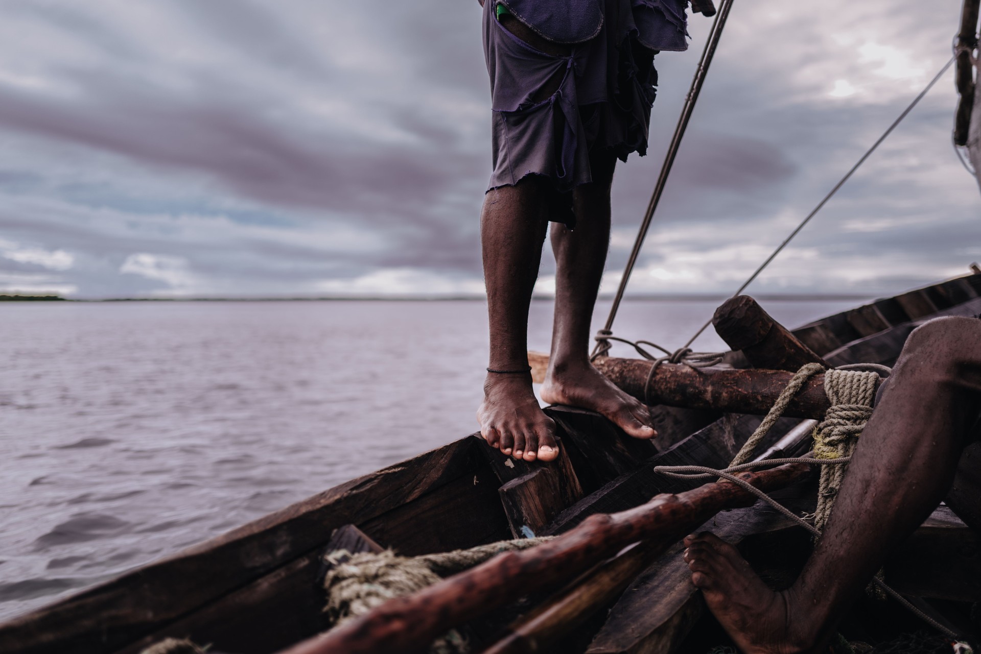Fisherman feet in the dhow boat